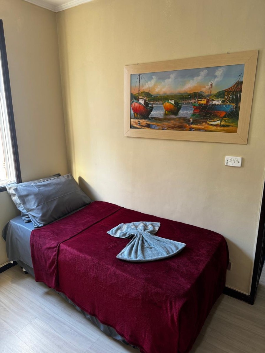 Apartamento à Venda na Praia do Gonzaguinha – 1 Dormitório Mobiliado Prédio Frente ao Mar