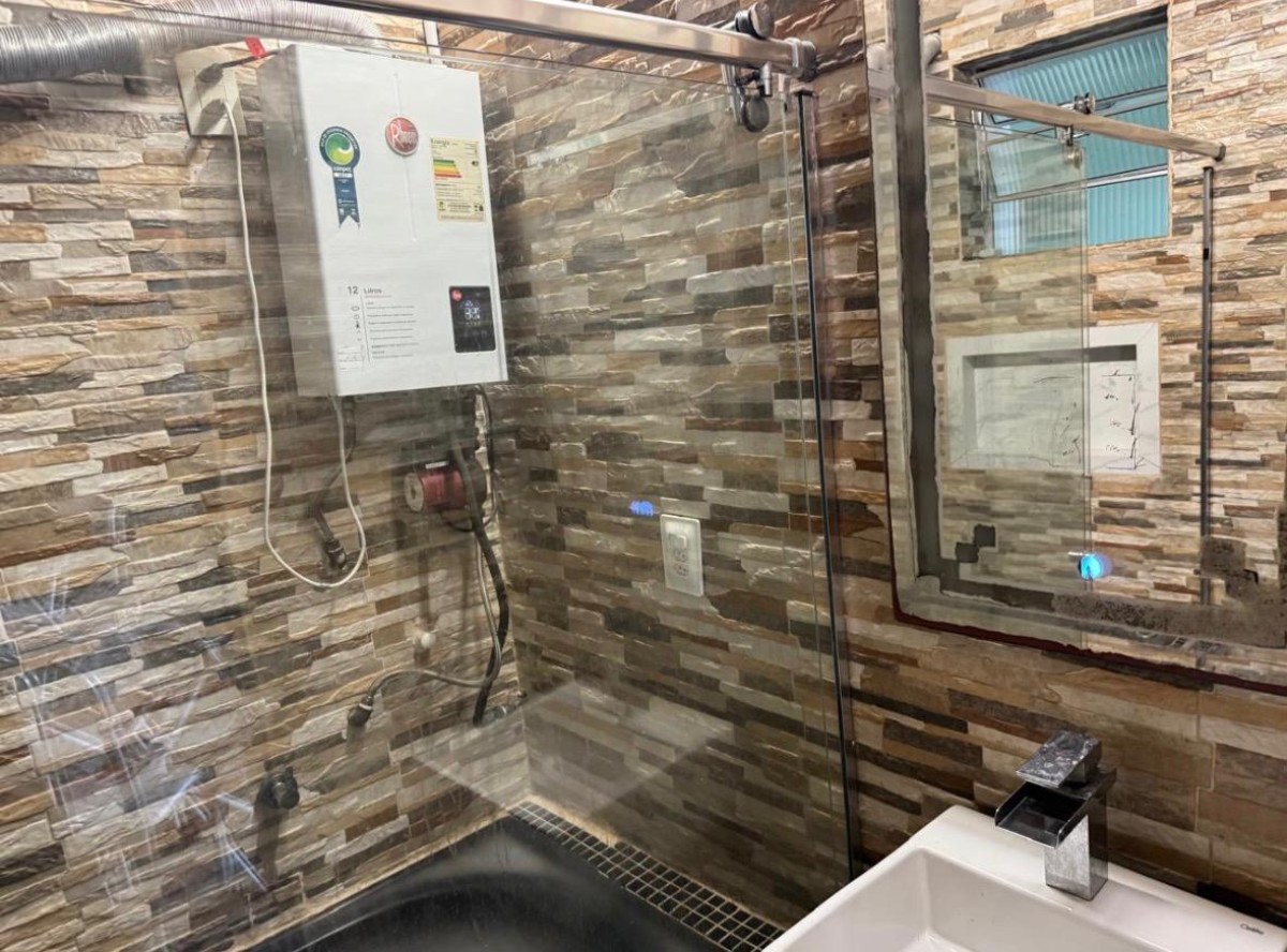 Apartamento à venda sala living com garagem em São Vicente/SP.